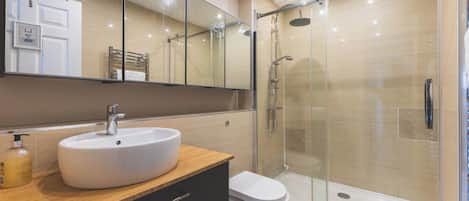 Shower, hair dryer, towels, soap