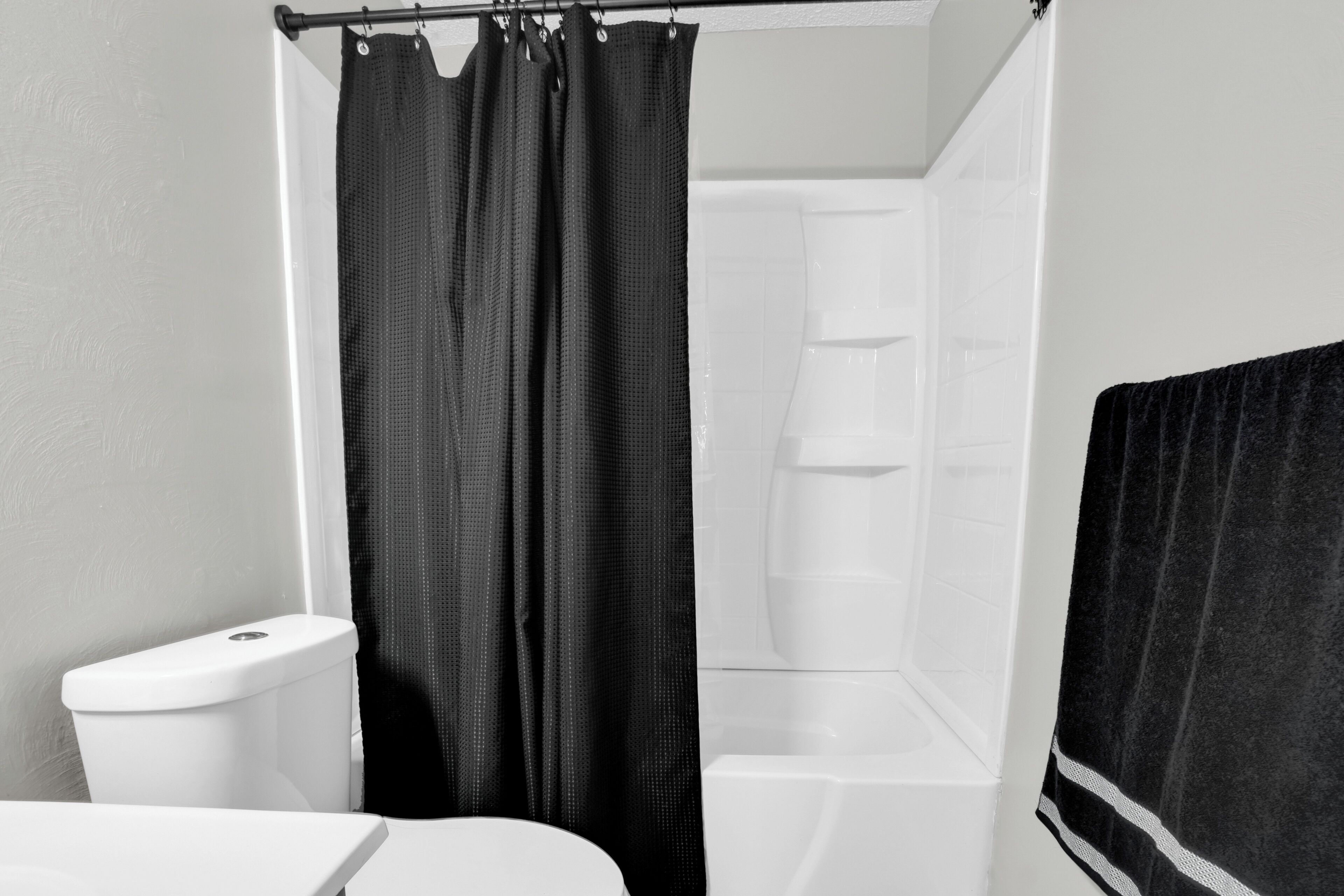 Shower, hair dryer, towels, toilet paper