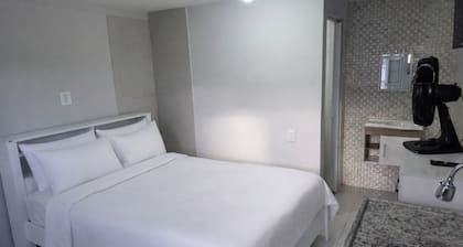 Cozy modern room with Wi-Fi, TV, and kitchen.