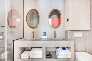 A bathroom with two sinks, a shower, and a toilet. There are towels and toiletries visible. - Modern Apartment - 2bd/8p - Place D'italie (Paris)