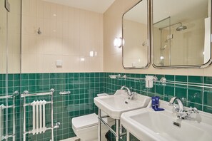 A bathroom with two sinks, a mirror, a towel rack, and a toilet. - Sublim AC Apartment 3 Bdr Saint Germain des Pres (Paris)