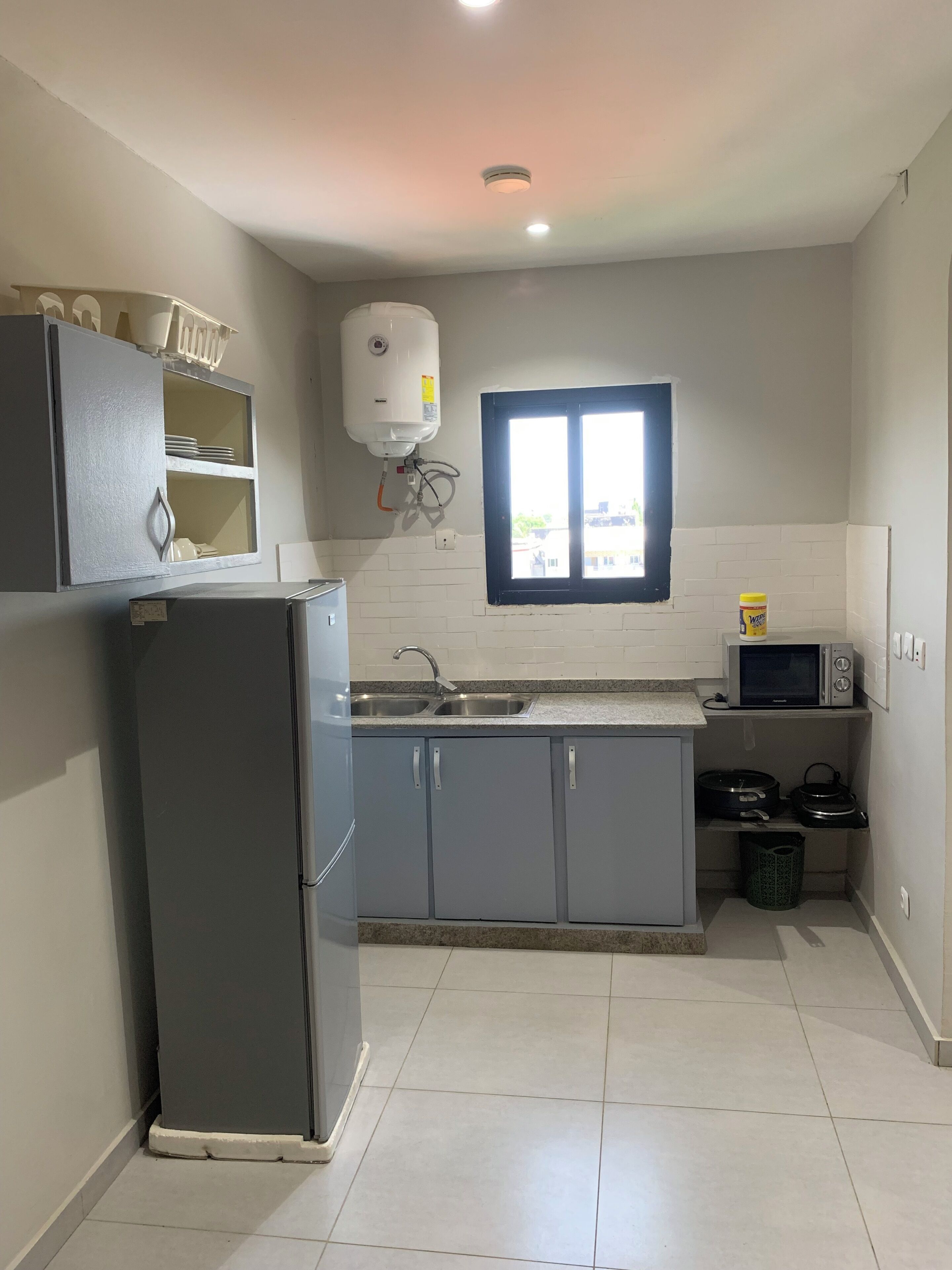 Appartamento Deluxe, vista città | Cucina privata | Microonde, pentole/stoviglie/utensili