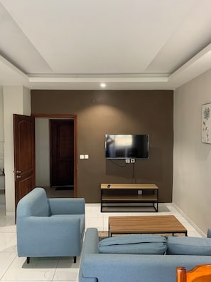 Departamento Deluxe, vista a la ciudad | Tabla de planchar con plancha, wifi gratis y ropa de cama