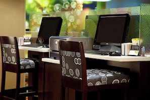 A hotel workspace with two computers, a printer, and patterned chairs. - King | Marriott Ithaca | Free Airport Shuttle, Cornell Minutes, Indoor Pool (Ithaca)