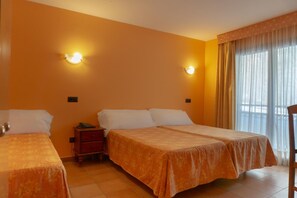 A hotel room with two beds, a nightstand, and a window with curtains. - Aparthotel Ransol (Ransol)