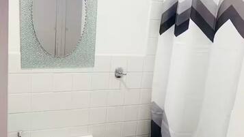 Shower, towels, soap, toilet paper