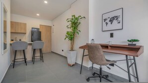A modern kitchen with a microwave, a refrigerator, and a potted plant. - Oslo 603 B in Medell n (Medellín)
