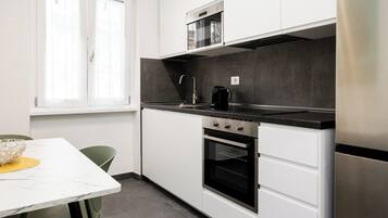 Apartment (1 Bedroom) | Private kitchen | Espresso maker, stovetop, electric kettle, cookware/dishes/utensils