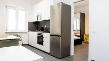 Apartment (1 Bedroom) | Private kitchen | Espresso maker, stovetop, electric kettle, cookware/dishes/utensils