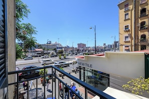 A city street with a building labeled "NEW TILE" in the foreground. - Via Nuova Marina 121 - Appartamento 1 (Naples)