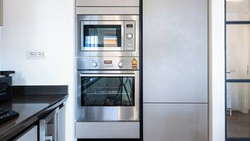 Apartment (1 Bedroom) | Private kitchen | Microwave, oven, stovetop, dishwasher