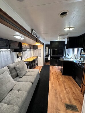 Living area - Happy Campers RV Stay • Private Yard • Sleeps 4-6 (Magnolia)