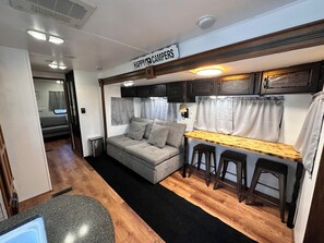 Living area - Happy Campers RV Stay • Private Yard • Sleeps 4-6 (Magnolia)