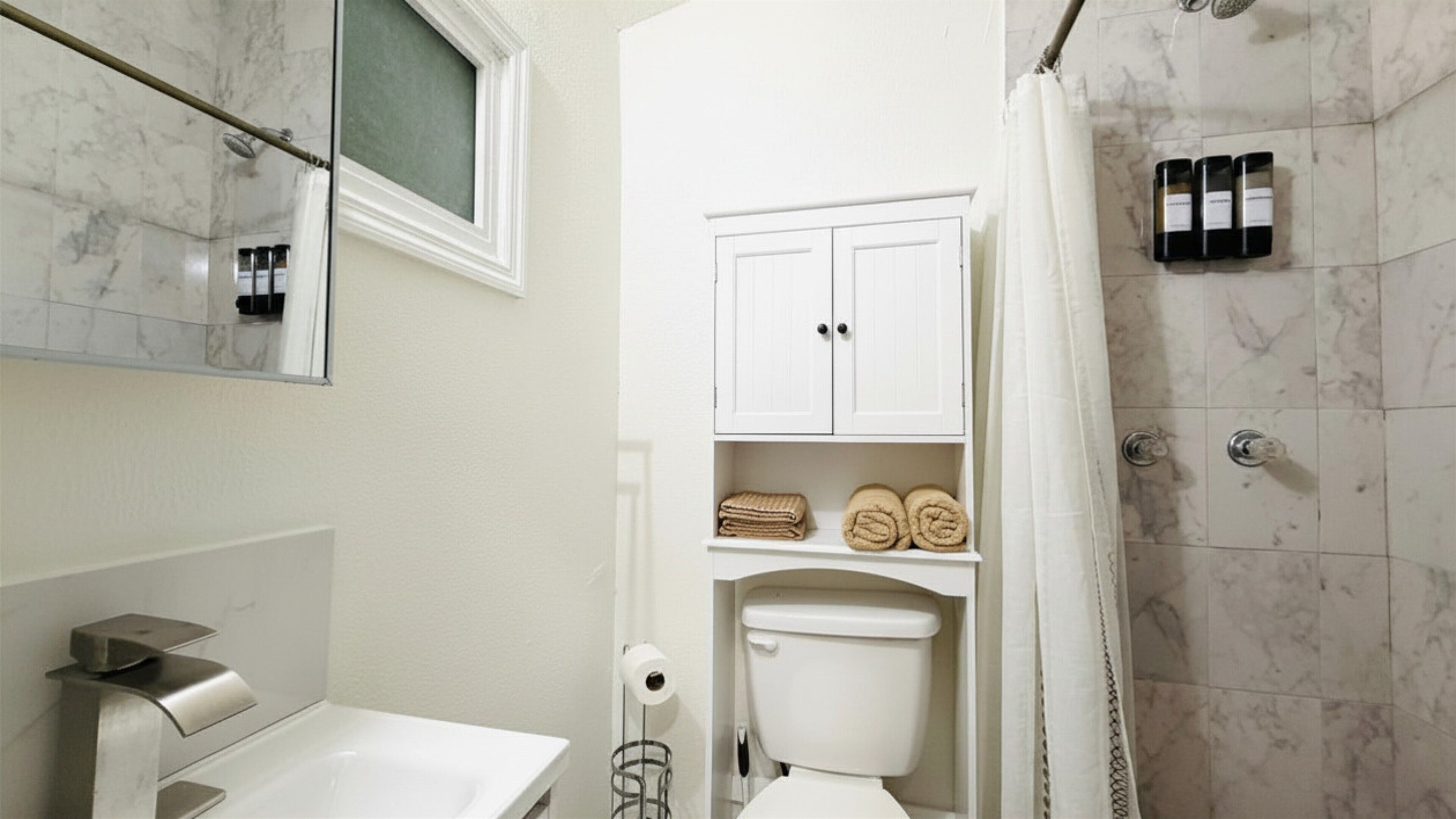 Shower, towels, soap, toilet paper