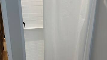 Shower, towels, toilet paper