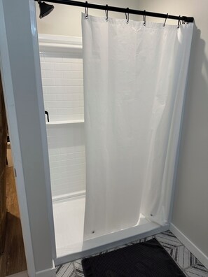 Shower, towels, toilet paper