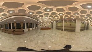 A spacious lobby with a curved ceiling, a seating area, and a reflective marble floor. - Amar Resorrt Motihari Bihar (Motihari)