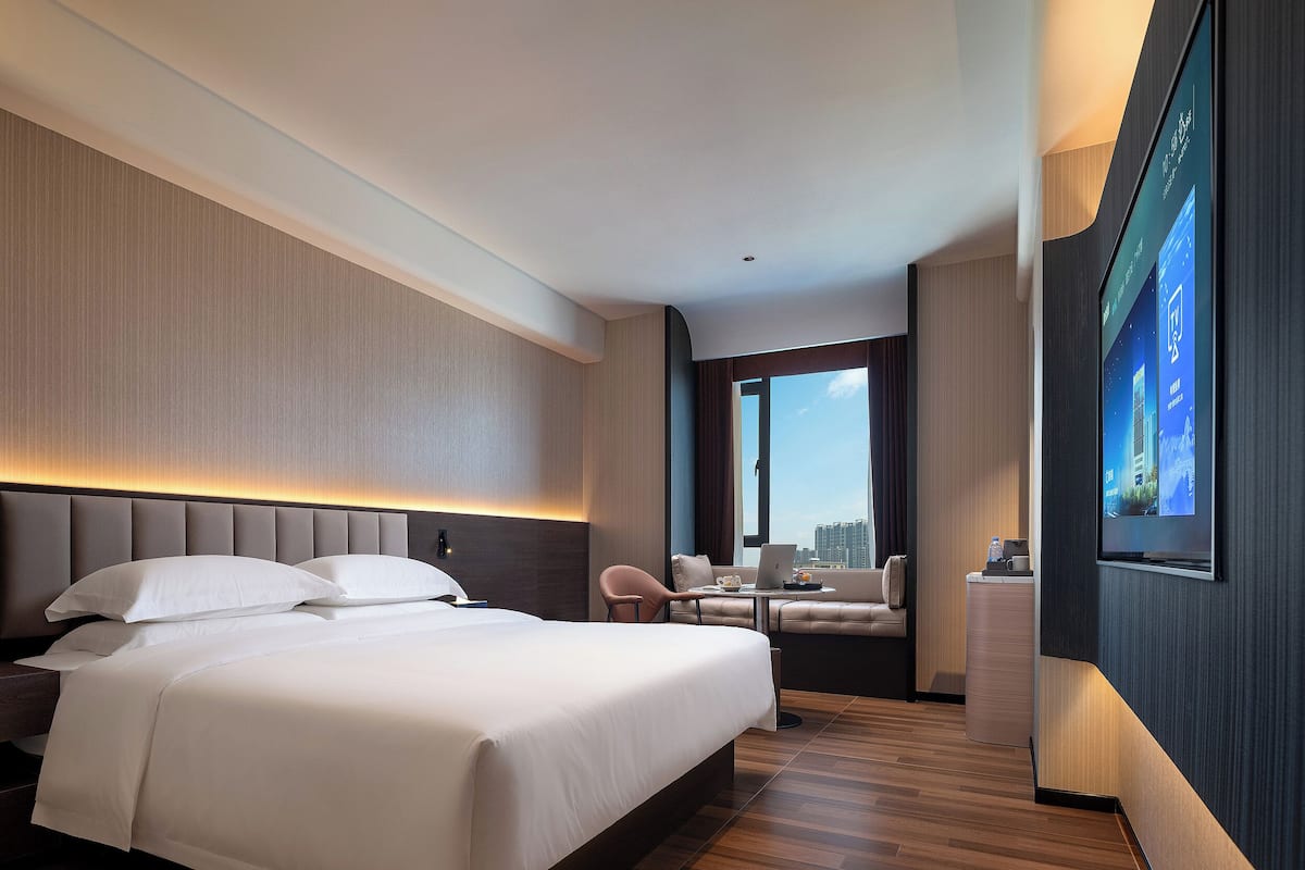 Quarto casal standard, vista para a cidade