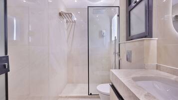 Shower, hair dryer, towels, soap