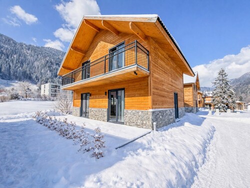 Chalet by a lake with stunning mountain views