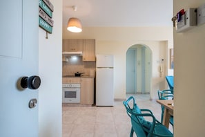 Apartment, 2 Bedrooms, Kitchen, City View | Private kitchen | Full-size fridge, microwave, oven, stovetop - Sunny 2-BR Apt. & Balcony in Mackenzie (Larnaca)