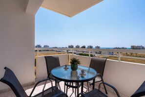 Apartment, 2 Bedrooms, Kitchen, City View | Outdoor dining - Sunny 2-BR Apt. & Balcony in Mackenzie (Larnaca)
