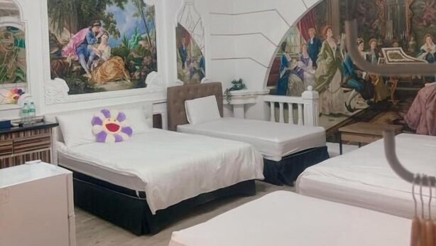 A room with two beds, a ceiling mural, and a chandelier. - Good 9 Stay Inn (Taipei)