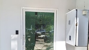 A white door with a frosted glass panel, a white wall, and a white ceiling. - AT Pranakorn (Bangkok)