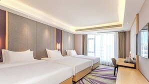 A hotel room with two beds, a desk, a TV, and a large window. - Lavande Hotel Tianmenshan Branch (Zhangjiajie)