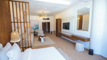 Deluxe Suite, 1 Queen Bed | Living area | 43-inch flat-screen TV with satellite channels