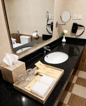 Shower, hair dryer, towels, toilet paper