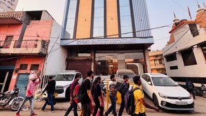 A building with a sign reading 'Rooms - Banquet Restaurant.' - Hotel Krishna Continental  (Prayagraj)