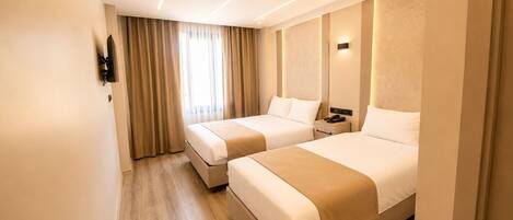 Family Twin Room, Balcony | Individually decorated, desk, laptop workspace, free WiFi