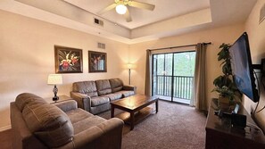 Appart'hôtel, plusieurs lits, balcon (Comfy Cove) | Coin séjour