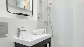 Shower, hair dryer, towels, shampoo
