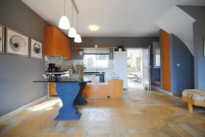 A modern kitchen with a central island, pendant lighting, and a view to the outside. - Porto Cheli 4Bedroom Villa Plunge Pool & SeaView 3 (Kosta)