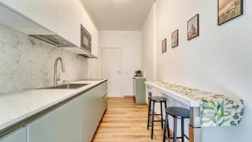 Apartment, Balcony, City View | Private kitchen | Fridge, microwave, stovetop, dishwasher