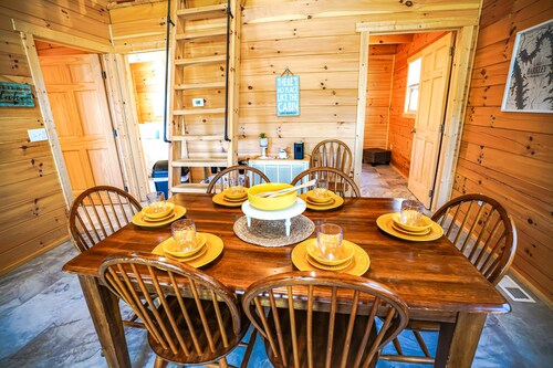 Lake Barkley Log Cabin - Lake Barkley Log is your perfect family escape on Lake Barkley! This charming log cabin offers two bedrooms, a sleeping loft, full kitchen, and bathroom with shower.