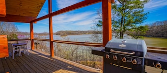 Waterfront Sunrise Bay Log Cabin - Lake Barkley Log is your perfect family escape on Lake Barkley! This charming log cabin offers two bedrooms, a sleeping loft, full kitchen, and bathroom with shower.