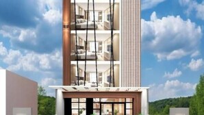 Ein mehrstöckiges Hotel mit modernem Design, mit einer gut sichtbaren Beschilderung 'HOTEL & BAR' oben.