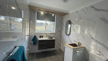 Shower, hair dryer, towels, soap