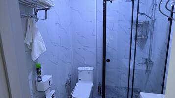 Shower, hair dryer, towels, soap