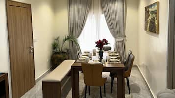 Family Apartment, Balcony, Pool View | Dining