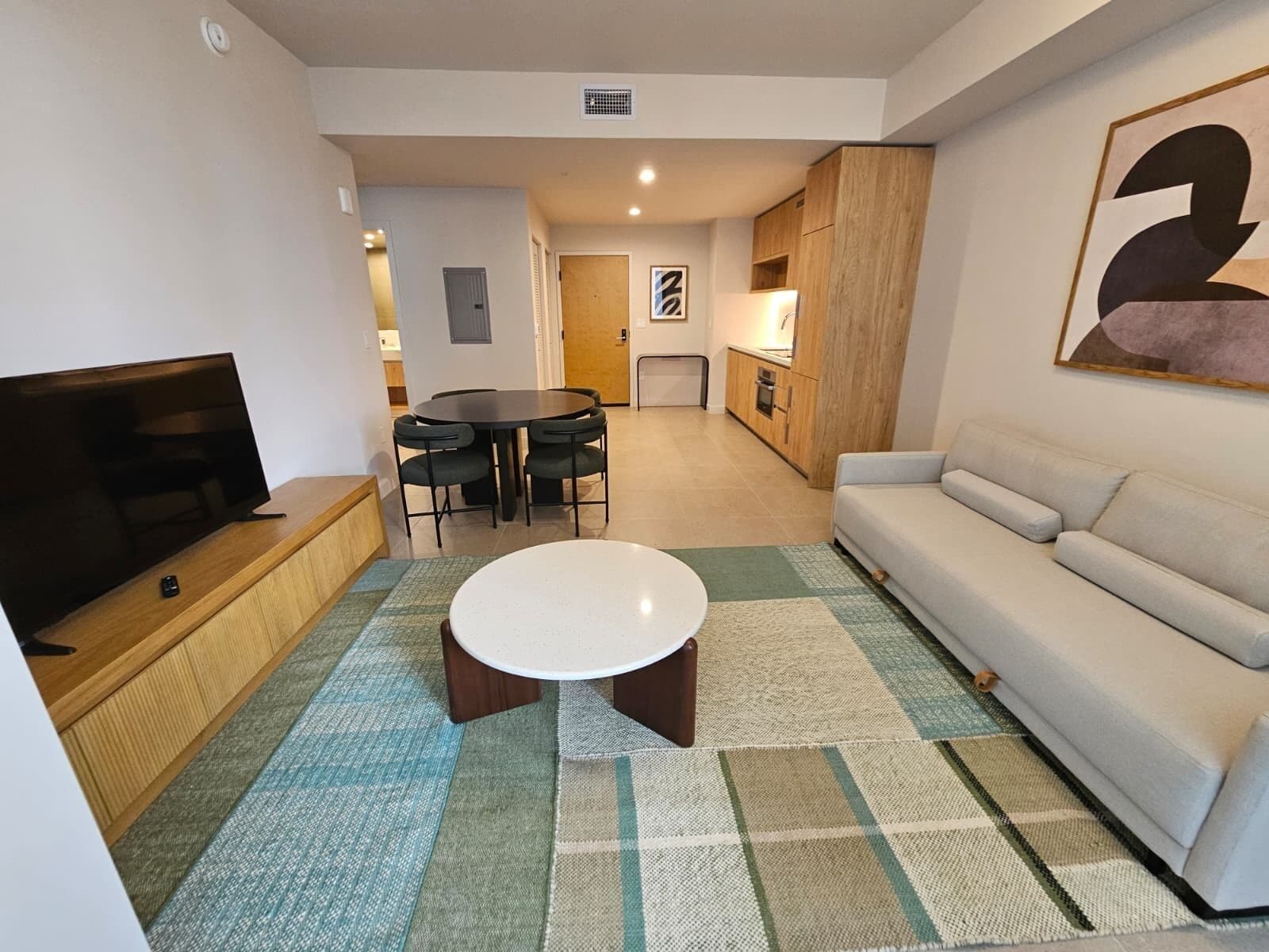 Premium Condo, 1 Bedroom, Balcony, City View | Living area | 55-inch Smart TV with digital channels, Netflix, foosball