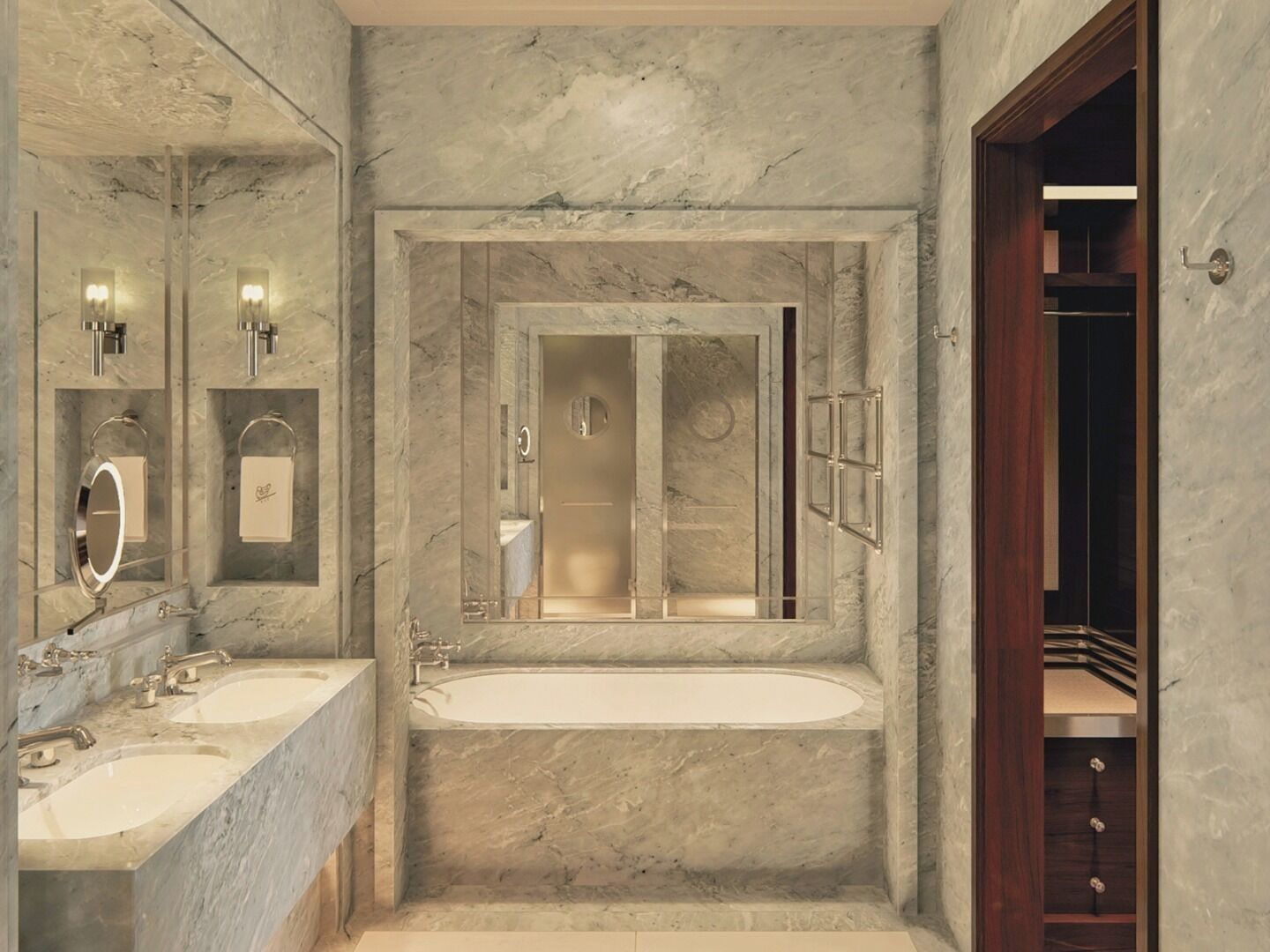 A bathroom with marble walls, a large bathtub, two sinks, and a mirror.