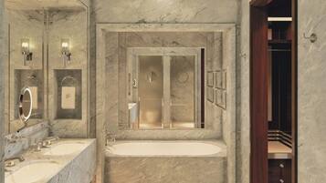 A bathroom with marble walls, a large bathtub, two sinks, and a mirror.