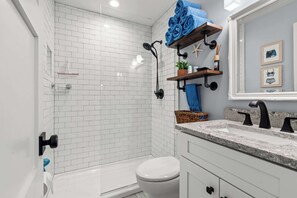 Shower, hair dryer, towels, shampoo