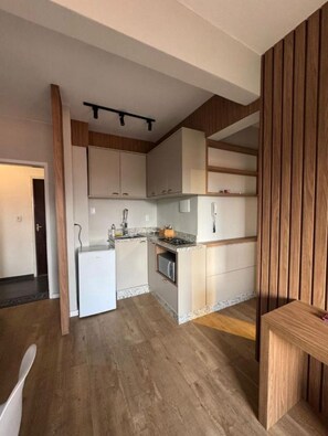 Private kitchen - Beautiful and modern apartment, close to the beach, with marina and barbecue area. (Balneário Camboriú)