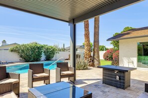 An outdoor patio with wicker furniture, a pool, and a covered area. - Families Welcome! Desert Oasis 3 Mi to Old Town (Scottsdale)