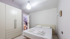 A bedroom with a bed, a wardrobe, and a light fixture. - Tranquility Villa With Pool Private Garden BBQ (Farkë)